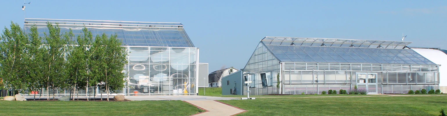 outside of two commercial greenhouses