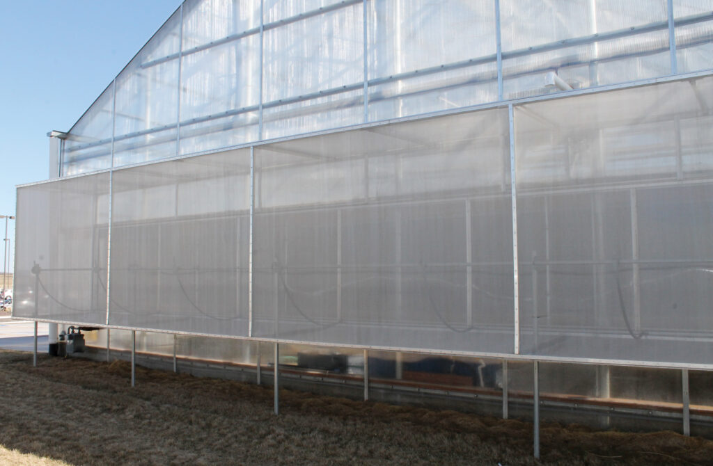 Insect netting system covering greenhouse vents