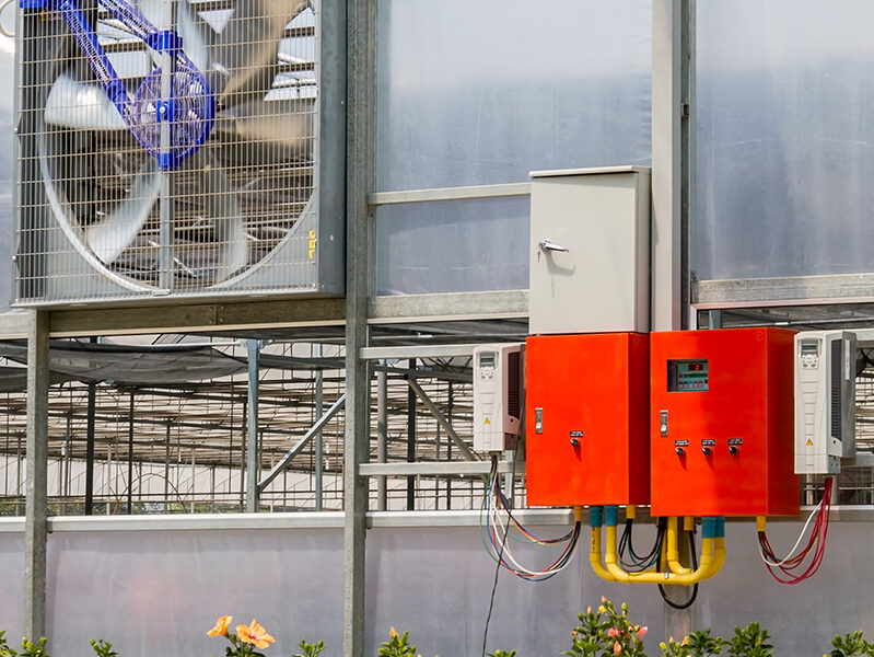 Greenhouse controller on interior greenhouse wall