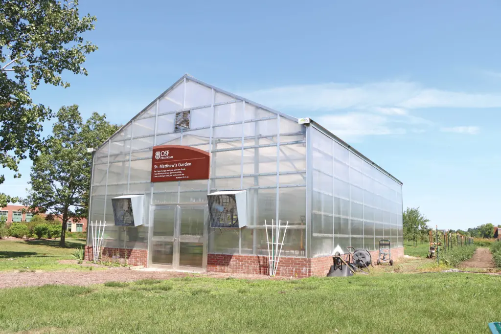 Greenhouse with polycarbonate cladding and galvanized steel framing