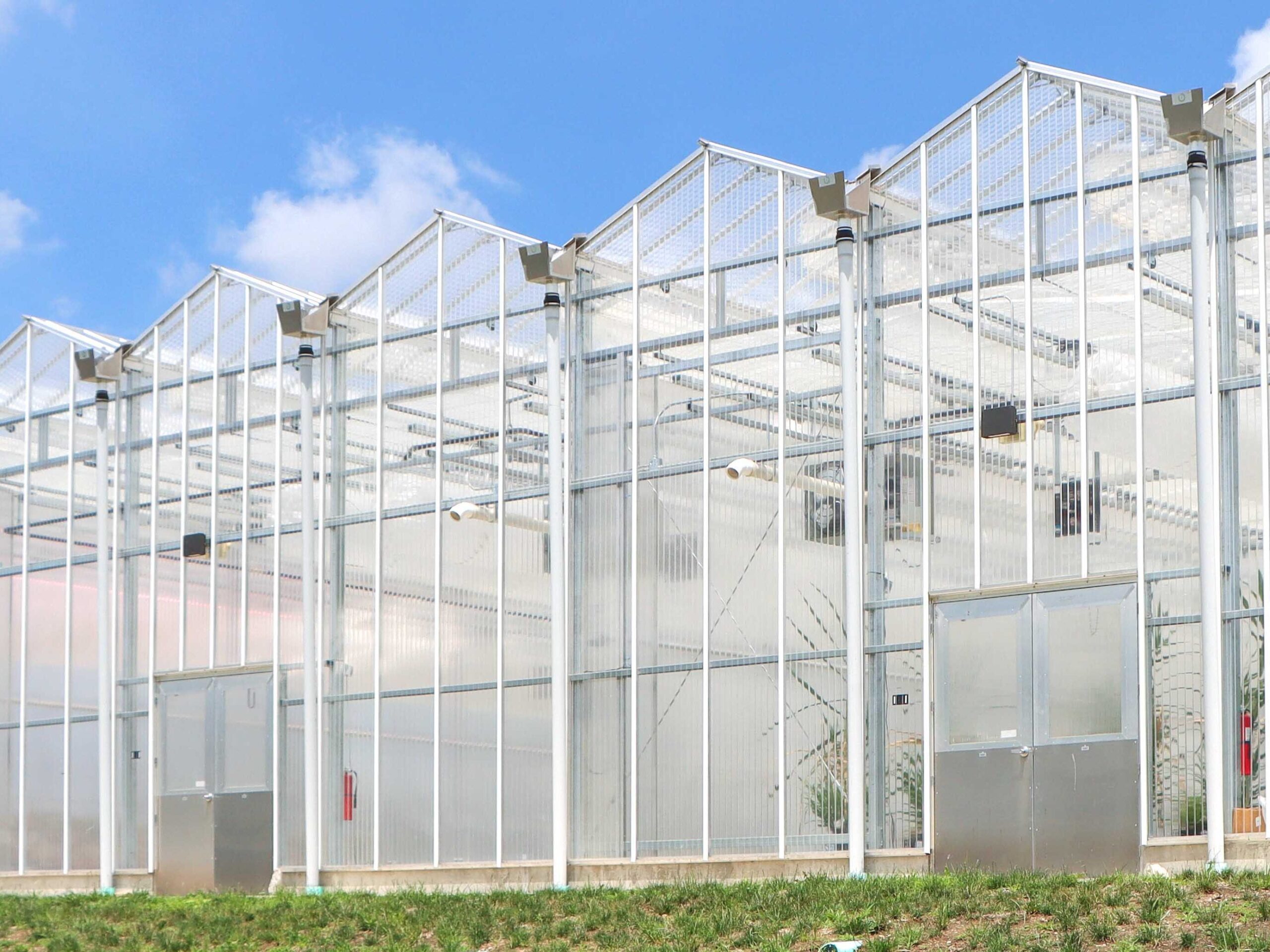 exterior end wall of venlo on graded grass hill