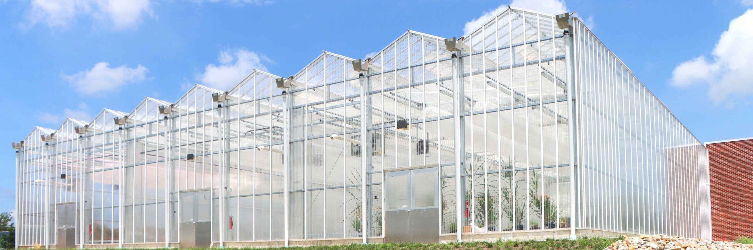exterior end wall of venlo on graded grass hill