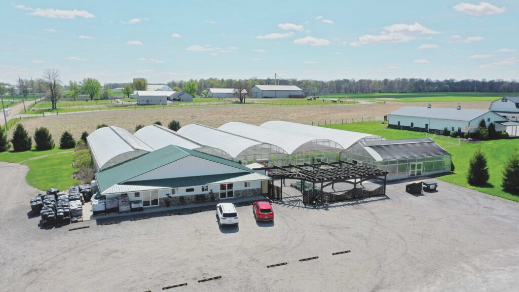 Angled aerial view of GrowSpan greenhouses at Glory Gardens